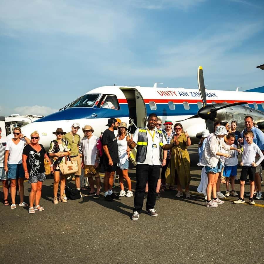 Early Morning Hotel Pickup & Flight to Mikumi - LITTLE LION TOURS AND SAFARIS Safari Clients Preparing for a Mikumi Safari from Zanzibar