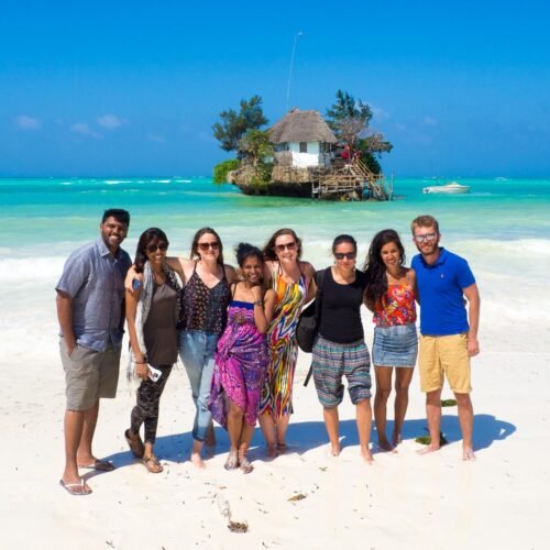 Visitors Posing on the Beach Near the Rock Restaurant in Zanzibar
