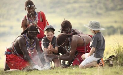 Children learning traditional skills from Maasai people in Tanzania